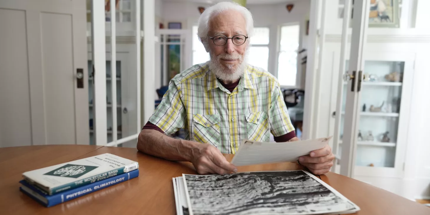 Paul F Hoffman sitting at his desk